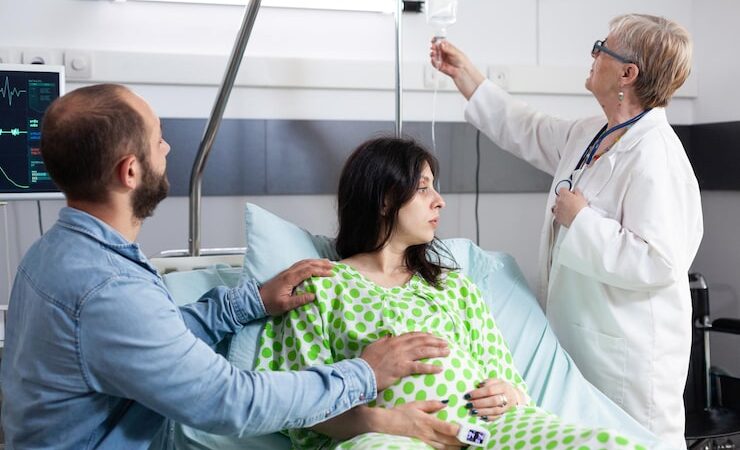 Best Egg Freezing Clinic in Delhi – Trusted Care with Dr Payal Bajaj 6 senior medic checking iv drip bag explaining caesarean surgery pregnant woman hospital ward woman with pregnancy lying bed discussing motherhood with future father 482257 64307