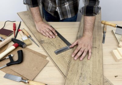 high-view-holding-wood-planks-carpentry-workshop-concept
