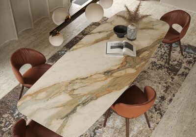 Featuring-a-bold-sculptural-base-made-of-curved-metal-plates-the-Scott-Keramik-table-blends-art